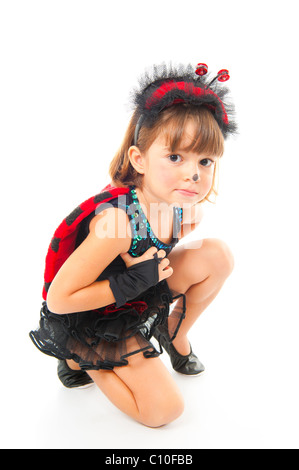 Bambino con Coccinella costume party in ginocchio. Foto Stock