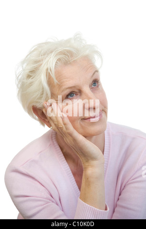 Un annoiato donna matura appoggia la testa sulla sua mano e rotea gli occhi Foto Stock