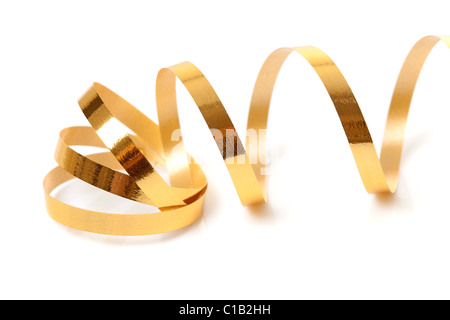 Golden streamer su sfondo bianco Foto Stock