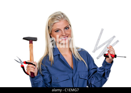 Giovane, bella donna con strumenti come un meccanico Foto Stock