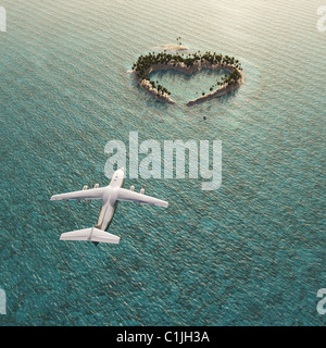 Volo in aeroplano sopra a forma di cuore isola tropicale Foto Stock