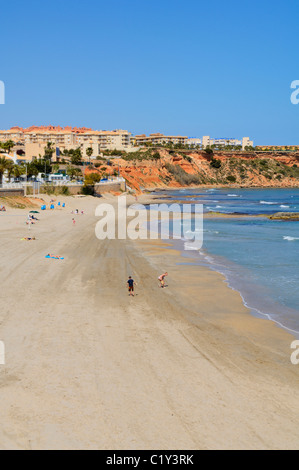 Aguamarina spiaggia a DEHESA DE CAMPOAMOR, Orihuela, provincia di Alicante, Spagna. Foto Stock