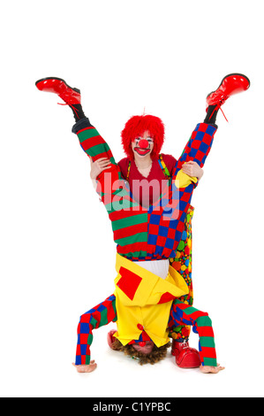 Giovane divertente pieno vestito clown capovolto Foto Stock