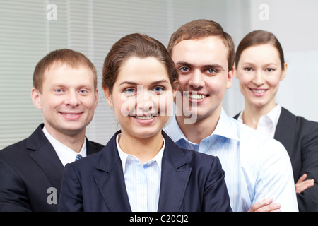 Ritratto di un allegro fiducioso team aziendale Foto Stock