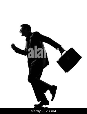 Silhouette business caucasica uomo felice esecuzione ith cartella piena lunghezza su studio isolato sfondo bianco Foto Stock