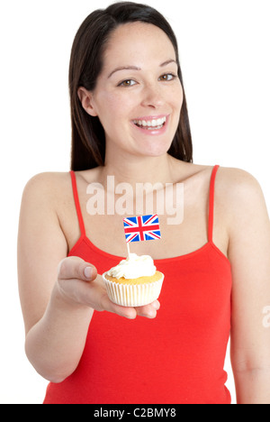 Donna felice coppa di ritegno la torta con la union jack flag - celebrazione festa Foto Stock