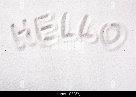 Ciao scritto in bella sabbia bianca Foto Stock