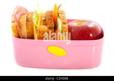 Pranzo sano nel riquadro rosa isolato su bianco Foto Stock