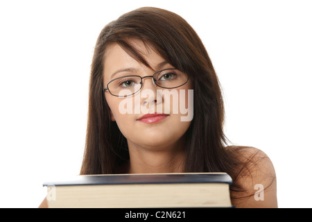 Ragazza Teen Learning , con un sacco di libri intorno, isolato su bianco Foto Stock