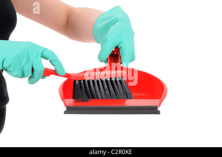 Paletta e spazzola in mani isolati su sfondo bianco Foto Stock