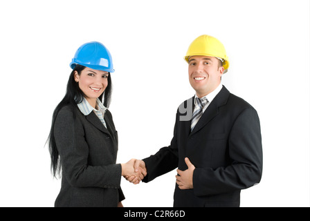 Business handshake con due giovani ingegneri molto felice Foto Stock