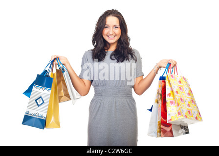 Pretty Woman il sollevamento e la mostra shopping bags isolati su sfondo bianco Foto Stock