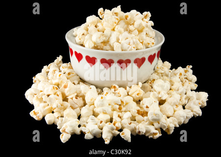 Foto di popcorn in una ciotola di cuore Foto Stock