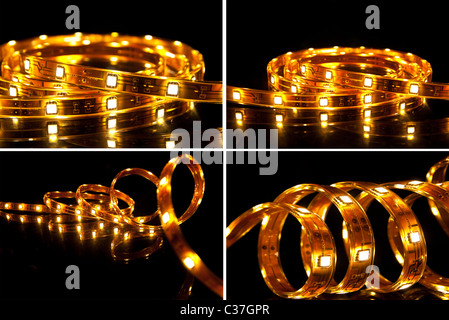 Quattro LED luminosi ghirlande su sfondo nero Foto Stock