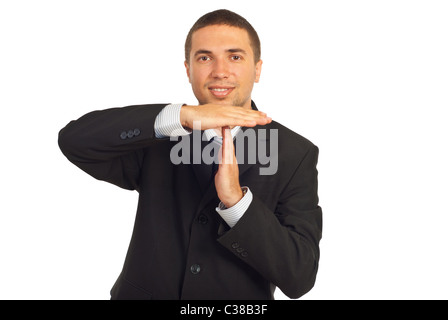 Business man gesticolando time-out e sorridente isolati su sfondo bianco Foto Stock