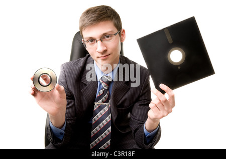Giovane con 8 pollici floppy disk e CD Foto Stock