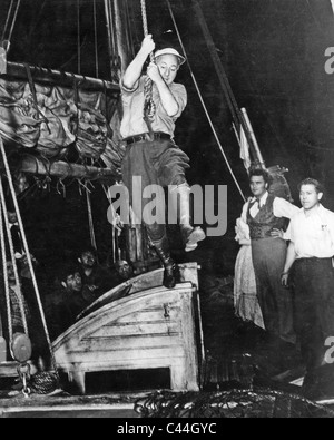 CECIL B. DeMILLE (1881-1959) usa il regista mostra come è fatto sul set del suo film 1942 sfruttare il vento selvaggio Foto Stock