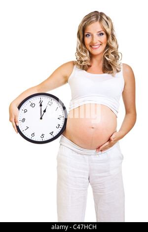 Donna incinta con orologio isolato su bianco data di scadenza concept Foto Stock