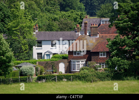 Case residenziali e cottages in un paesaggio rurale impostazione, Ditchling, East Sussex, England, Regno Unito Foto Stock