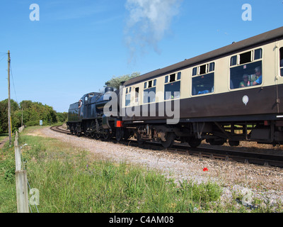 Locomotiva a vapore lasciando Watchet stazione. West Somerset Railway. Regno Unito