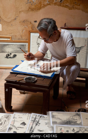 Artista cinese pittore al lavoro Foto Stock