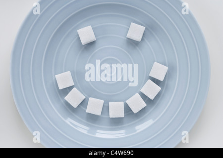 Zolletta di zucchero Smiley Face Foto Stock