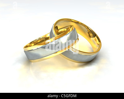 Una coppia di golden gli anelli di nozze con intarsi di platino Foto Stock