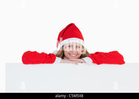 Carino biondo e donna vestiti da Babbo Natale Foto Stock