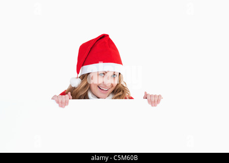 Sorridente bionda donna vestiti da Babbo Natale Foto Stock