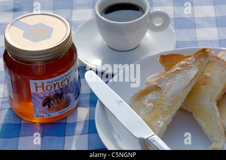 Il miele in inglese sul tavolo per la colazione Foto Stock