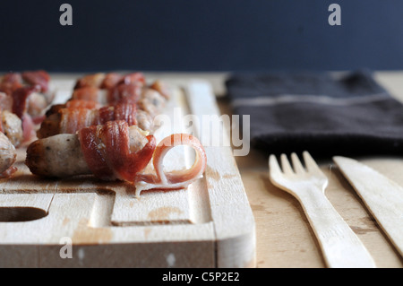 Cocktail salsiccia avvolto in pancetta Foto Stock