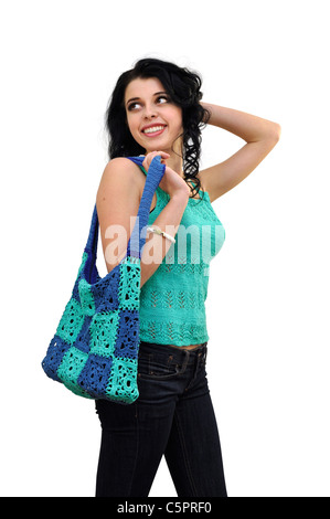 Giovane bella signora allegro con una borsa alla moda nella sua mano cercando da parte. Foto Stock