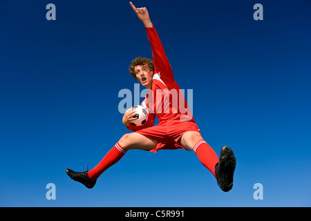 Giocatore di calcio celebra. Foto Stock