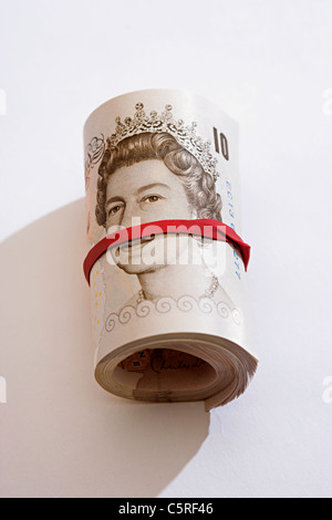 Rotolo di dieci pound note Foto Stock