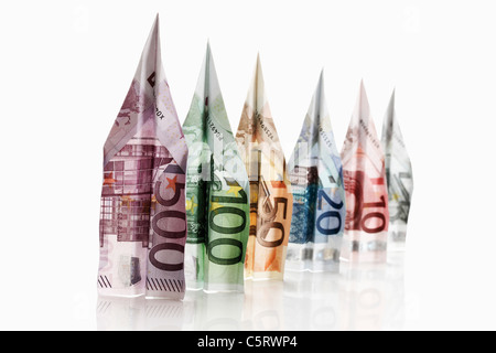 Gli aeroplani di carta piegato da banconote in euro Foto Stock