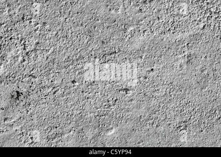 La consistenza del vecchio grigio muro di cemento Foto Stock