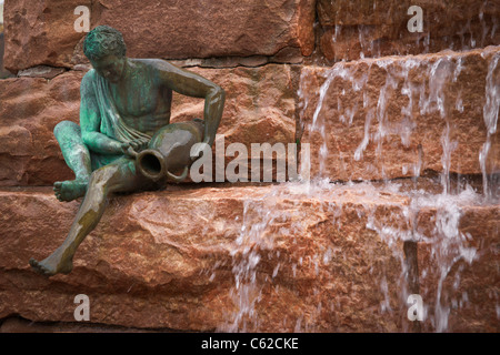 City of Sioux Falls downtown in South Dakota  Public sculpture of Bacchus sitting by a waterfall in USA US nobody horizontal hi-res Foto Stock