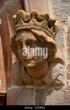 Scolpita in testa femmina a ovest porta, Chiesa di San Giovanni. Skirwith, Cumbria, England, Regno Unito, Europa. Foto Stock