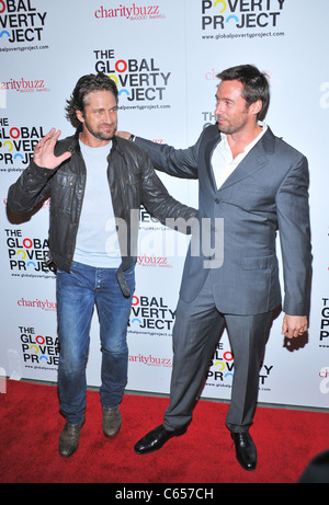 Gerard Butler, Hugh Jackman presso gli arrivi per la povertà globale progetto ospiterà il lancio globale di 1,4 miliardi di motivi, MoMA Foto Stock