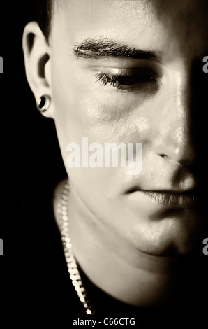 Metà faccia di giovane Foto Stock