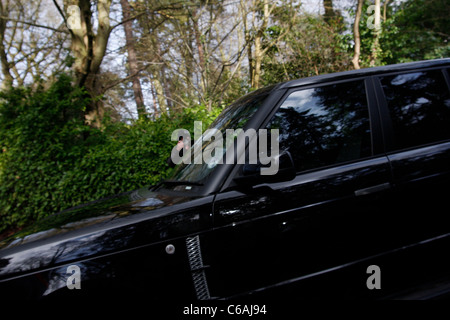 Un John Terry decoy look-a-come le foglie John Terry in casa sua auto e capi per il Chelsea Football di allenamento e quindi Foto Stock