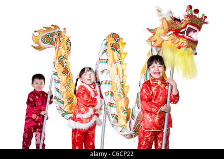 Tre bambini cinesi azienda dragone cinese Foto Stock
