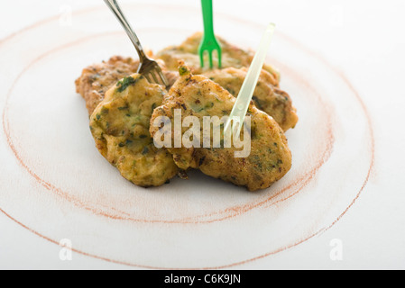 Pesce e frittelle alla citronella Foto Stock