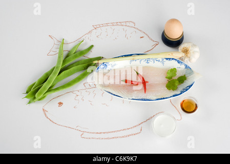 Pesce e frittelle alla citronella Foto Stock