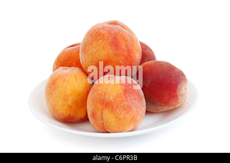 Diverse le pesche su una piastra Foto Stock