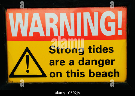 Attenzione! Forti maree sono un pericolo su questa spiaggia simbolo di sicurezza, Brancaster, Norfolk, Inghilterra, Regno Unito Foto Stock