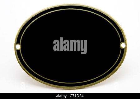 Nero e oro bianco medaglione ovale isolato su sfondo bianco Foto Stock