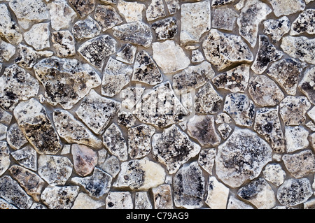 Texture di antichi muri di pietra come sfondo Foto Stock