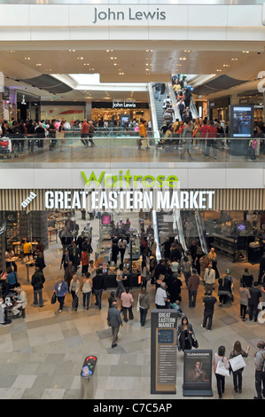 John Lewis department store ingresso & Waitrose segni su due piani di centri commerciali interni a Stratford City Westfield Shopping Centre Newham Regno Unito Inghilterra Foto Stock