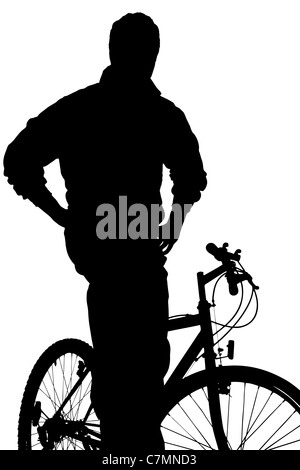 Una silhouette di un giovane ragazzo in posa su una bici Foto Stock